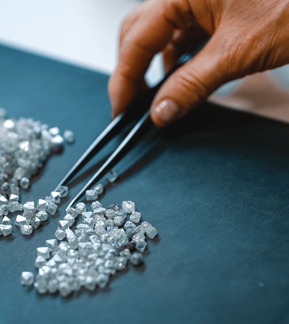 Raw diamonds being organized on table